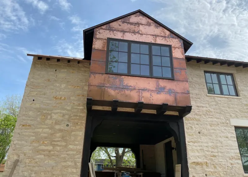 Copper metal panel facade on a stone building for Metal Roof Coating in Morganton